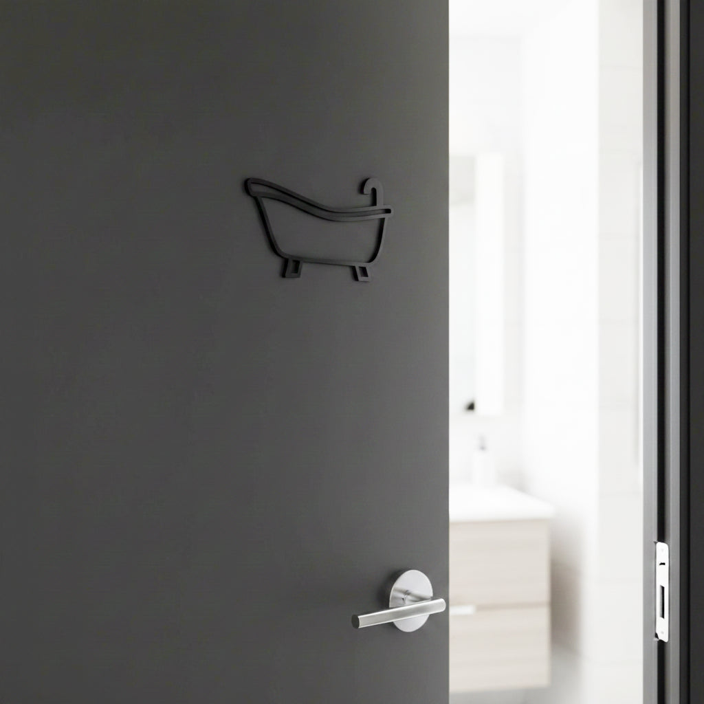 Gray door with a bathtub-shaped key holder and a silver handle.
