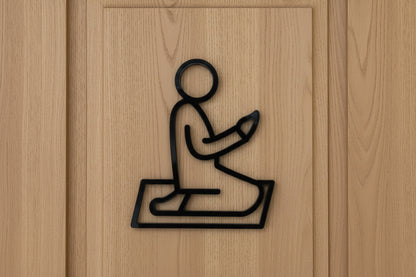 Praying man sign on the wooden door
