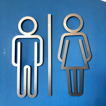 Metallic male and female symbols on a blue background